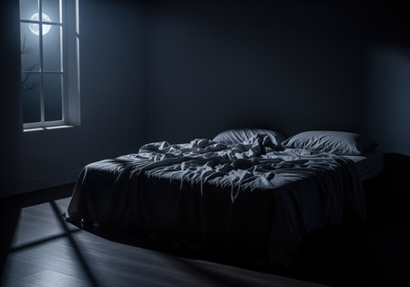 Empty, unmade bed dominating a dark bedroom interior. cold, blue moonlight streams through a window, casting sharp shadows on the floor. evokes feelings of loneliness, insomnia, mystery, or absence.の素材