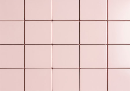 Smooth light pastel pink ceramic tiles arranged in a seamless grid pattern, creating a clean and modern background texture. ideal for design, interior, and abstract concepts.の素材