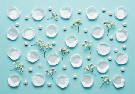White rose petals, delicate baby breath flowers, and lustrous pearls arranged in an elegant pattern on a soft blue background. perfect for wedding, beauty, or luxury themes.の素材