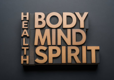 A conceptual word abstract showing HEALTH BODY MIND SPIRIT spelled out with vintage wooden letterpress blocks. this represents holistic wellness and balance.の素材