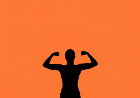 A striking silhouette of a woman flexing her arm muscles, representing strength, determination, and physical fitness. this image conveys empowerment and healthy lifestyle.の素材