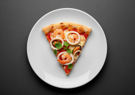 A perfectly cooked slice of seafood pizza topped with succulent shrimp, tender calamari rings, fresh mussels, and basil leaves. ideal for menus, food blogs, or culinary promotions.の素材