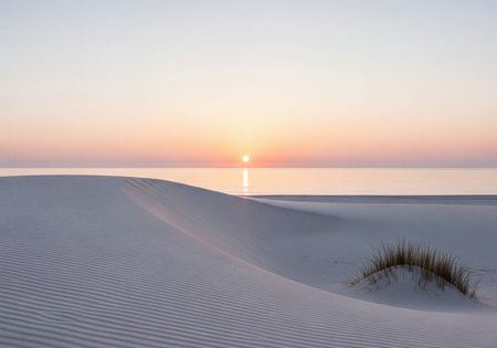 Pristine white sand dunes curve gently alongside a calm, reflecting sea under a soft pastel sky at sunrise. A minimalist coastal landscape showcasing tranquil natural beauty.の素材