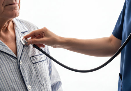 A close up view of a healthcare professional using a stethoscope to listen to the chest of an elderly male patient, symbolizing routine medical care and health checkups.の素材
