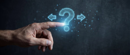 A male hand extends an index finger to touch a glowing blue holographic question mark symbol situated between two directional arrows pointing left and right against a dark background.の素材