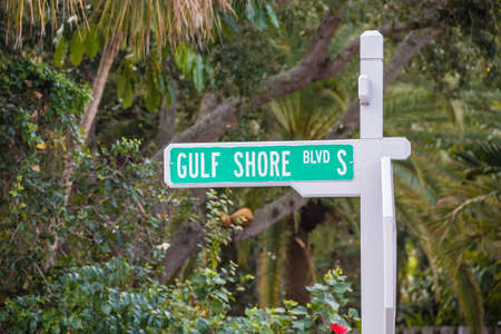 NAPLES- JANUARY 19, 2014  Street sign of gulf shore road taken on January 19, 2014 in Naples, USAのeditorial素材