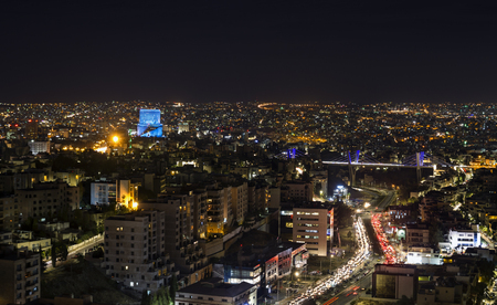Traffic jam in Amman city at night - Abdoun bridge and Amman mountains at nightの写真素材