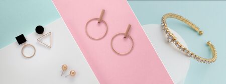 Colorful pastel colors collage of modern golden jewelries bracelet and earrings on green and pink