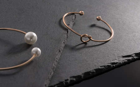 Knot shape modern bracelet on natural black stone plates