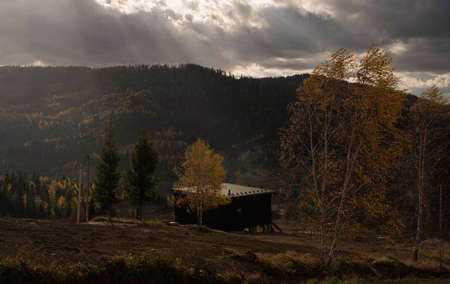 View of wooden cabin on top of mountain