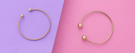 Panorama Top view of modern bracelets on pink and purple background dividedの写真素材