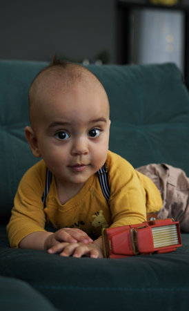 Portrait of adorable kid in yellow shirtの写真素材