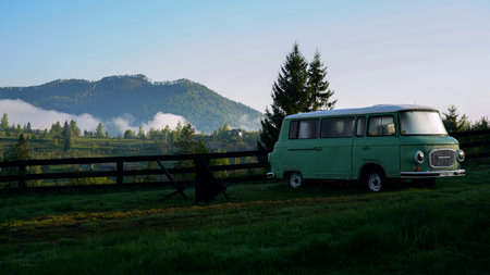 Vintage decorative van parked on foggy mountainsの写真素材