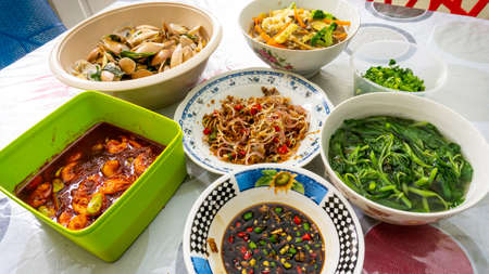 Normal feast or food in Malay culture. Eat variety of dishes and mixed with white rice during lunch. Balance diet. Family gathering event. In Malaysia, we called it Nasi Campur.の写真素材