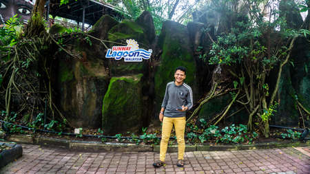 Subang Jaya, Malaysia - November 28, 2019: A portrait of a man visiting Sunway Lagoon theme park in...