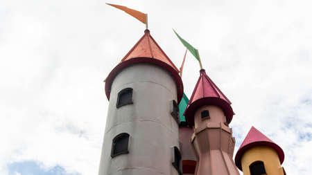 Castle tower with mini flag at the peak and white sky as background at Sunway Lagoon theme park in Bandar Sunway.のeditorial素材