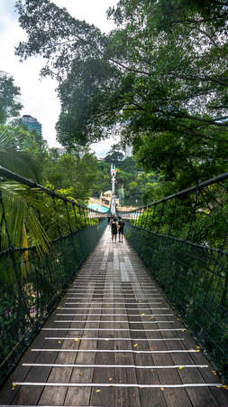 Subang Jaya, Malaysia - November 28, 2019: The Malaysia's longest pedestrian suspension bridge at Sunway Lagoon theme park in Bandar Sunway. Fantastic view of the park from the bridge.のeditorial素材