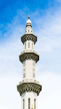 The minaret tower Sri Sendayan Mosque Negeri Sembilan with clear blue sky as background. Minimalist architecture concept design.のeditorial素材
