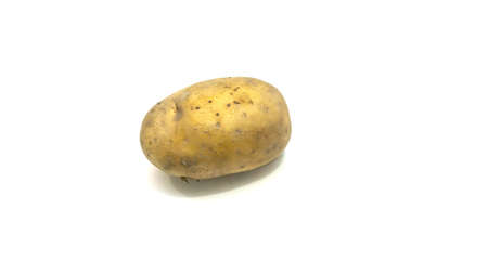 Raw brown potato on isolated white background.の写真素材