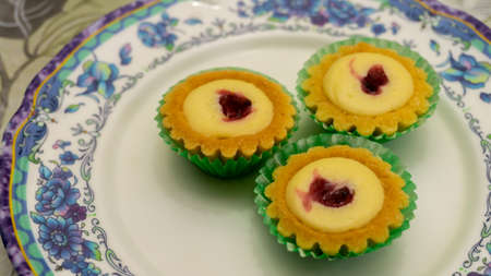 Mini blueberry cheese tart on a plate. Delicious dessert usually found during Eid Mubarak or Hari...