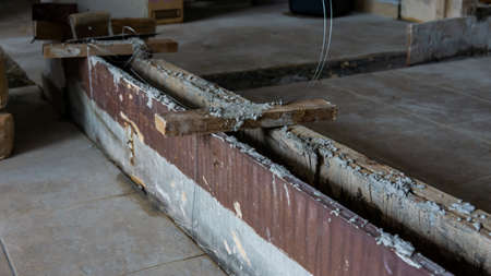 Close up view of construction process making a wall of a building. Form work wall concrete using...