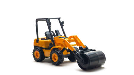 Construction machinery yellow road roller kids toy on isolated white background. Compactors heavy equipment vehicle for asphalt.の写真素材