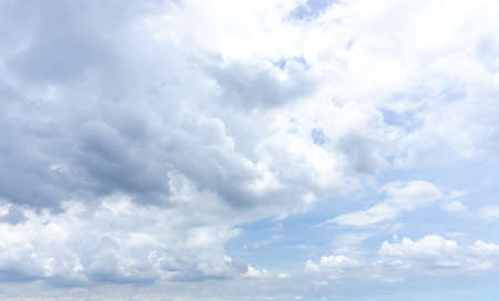 Beautiful white fluffy clouds formation on vivid blue sky know as raincloud