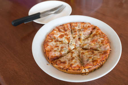 close-up,Delicious Pizza with Ham, Bacon and sausagesの写真素材