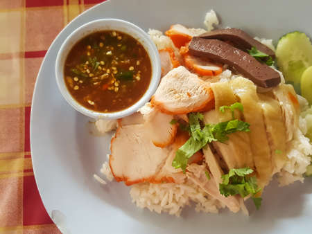 Thai food style: "Kao Mun Khai-Mhoo Dang"it's boil chicken and red pork served with rice and sauce.の写真素材
