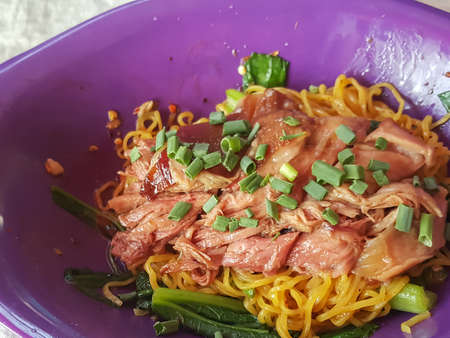 Close-up,Thai food style:"Ba Mhee Kha Moo" Egg noodle with stewed leg porkの写真素材