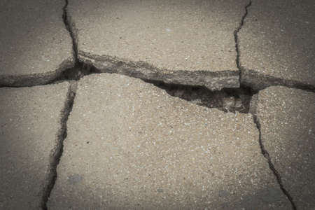 Broken concrete wall with cracks wall for textureの写真素材