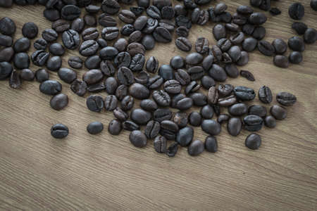 Coffee beans on wood background