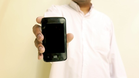 man hand is holding smartphoneの写真素材
