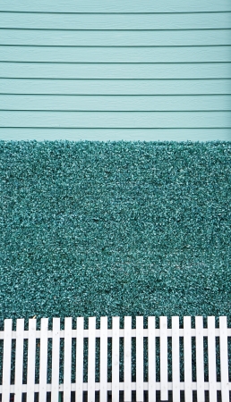 Blue wall with white fence backgroundの写真素材