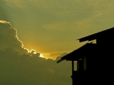 House silhouette with gorgeous sunset sky backgroundの写真素材