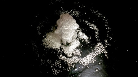 Fragment of a waterfall on black backgroundの写真素材