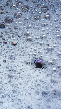 white foam with some bubbles in itの写真素材