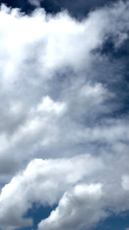 dark blue sky with cloudsの写真素材