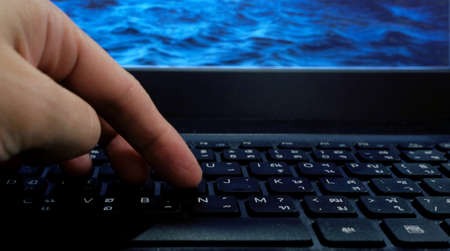 Hand on the computer keyboardの写真素材