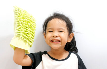 Little girl cleaning isolated on white background