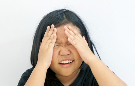 little girl with headache and problemsの写真素材