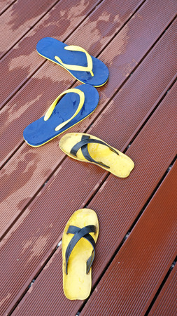 sandals by a swimming poolの写真素材