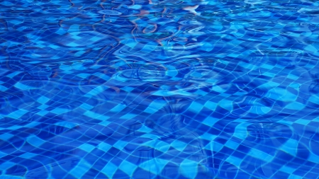 Blue ripped water in swimming poolの写真素材