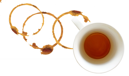 Coffee cup over white painted background  Dregs in the bottom of the cup, with stainsの写真素材