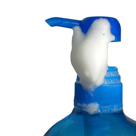 Pump bottle with soap foam isolate on white backgroundの写真素材