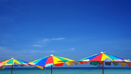 colorful umbrella beach on sunny summer dayの写真素材