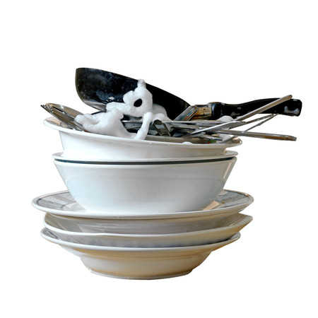 stack of dirty dishes and silverware with bubbles isolated on whiteの写真素材