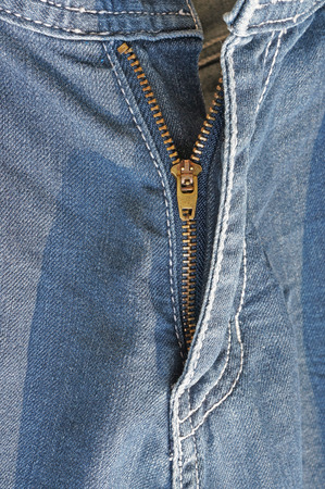 Closeup of a male open jeans zipperの写真素材
