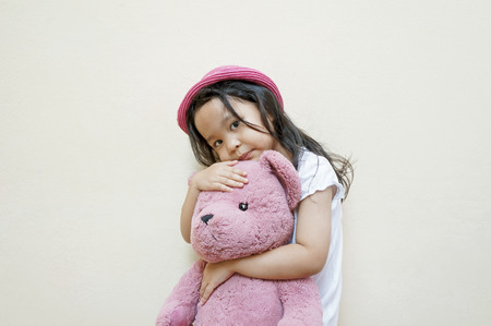 pretty little girl with teddy bearの写真素材
