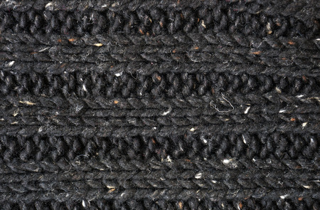 background of black knitted fabric